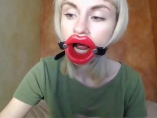 Zooming in Red Lips introduce Mouth Gag for Dildo-blowjob.