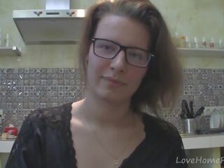 Solo babe with glasses chatting in the kitchen
